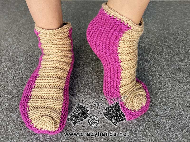 knit flat two-color slippers on female's model feet