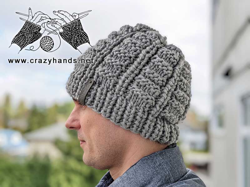 chunky knit slouchy hat on a male model - left-side view