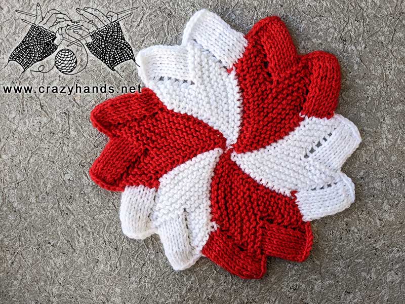 knit lollipop coaster made with white and red yarn