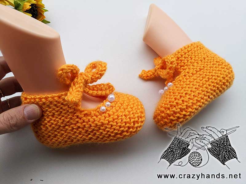 a pair of flat knit sandals for 0-12 months old baby