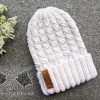 knit lunar cable hat on a flat surface