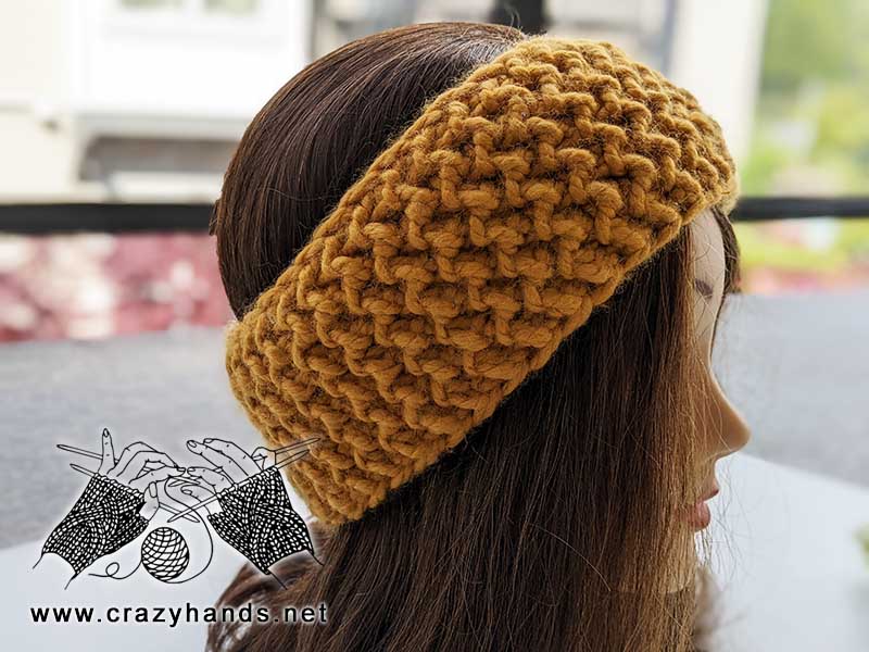 super bulky knit headband on the mannequin's head - side view