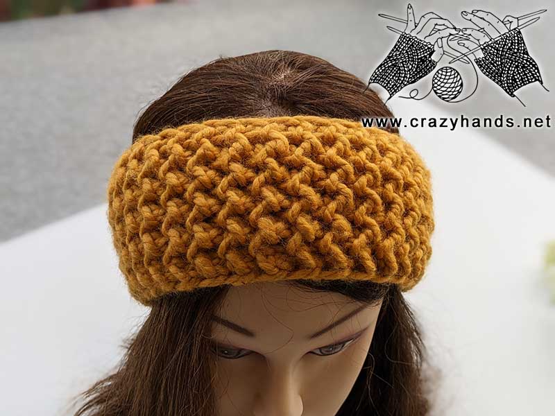 super bulky knit one-row headband on the mannequin's head - front view