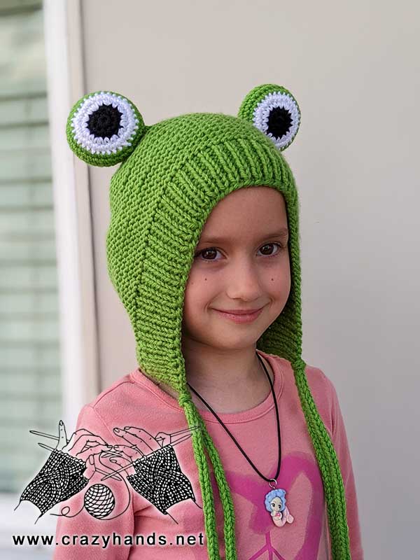 knit frog hat on a 6 years old girl