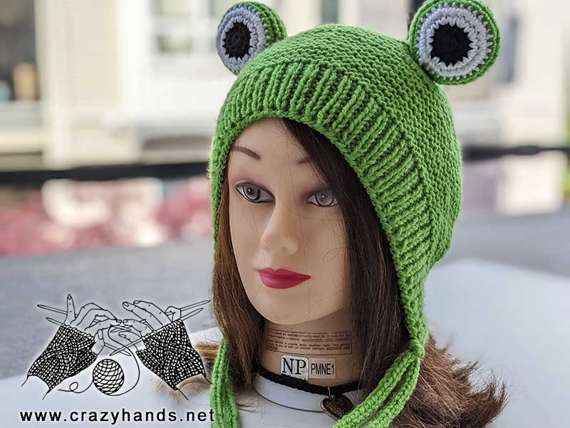 knit frog hat on a female head mannequin - left side view