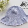 summer knit bucket hat on a flat surface