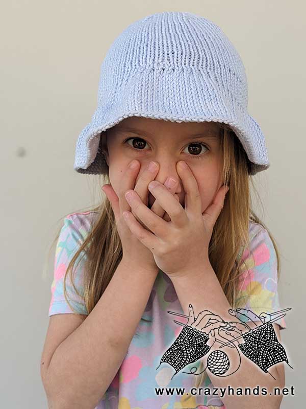 knit summer bucket hat on a toddler girl