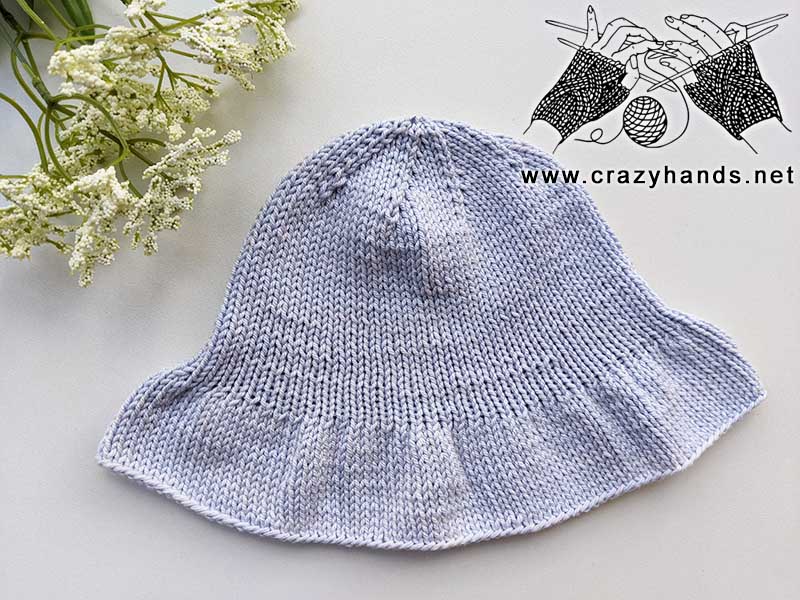 summer knit bucket hat on a flat surface