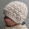 knit newborn baby hat on a doll mannequin - side view