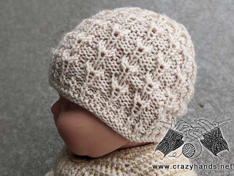 knit newborn baby hat on a doll mannequin - side view