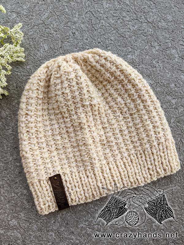 knit two-needles hat on a flat surface