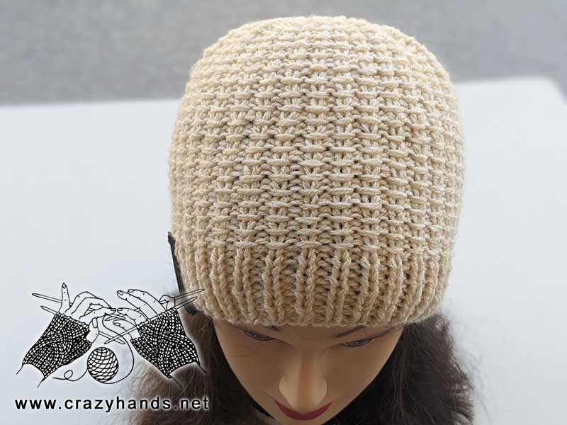 knit two-needles hat on a mannequin's head - front side view