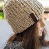 knit two-needles hat on a mannequin's head - right side view