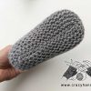 bottom view of the flat knit baby sock on a mannequin feet