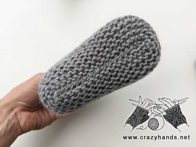 bottom view of the flat knit baby sock on a mannequin feet