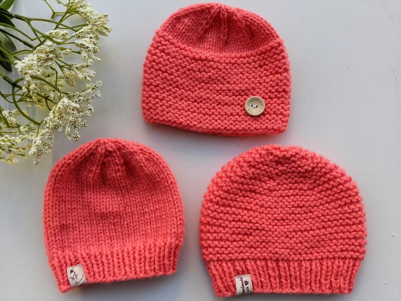 three different knit beanies for newborn babies