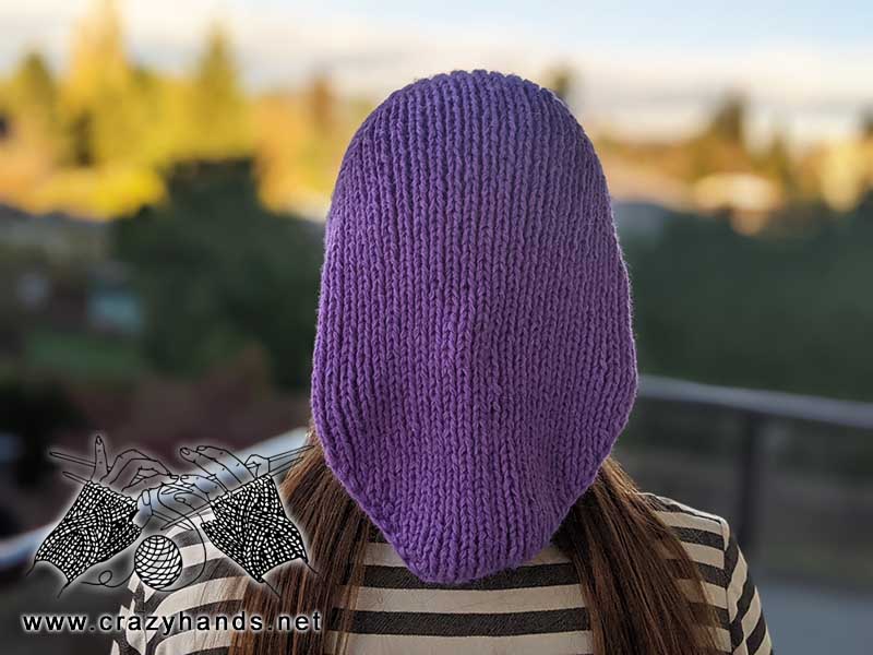 knit winter bandana kerchief on a female model - unbuttoned backside view