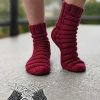 knit caterpillar socks on female model's feet