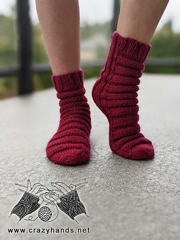 knit caterpillar socks on female model's feet