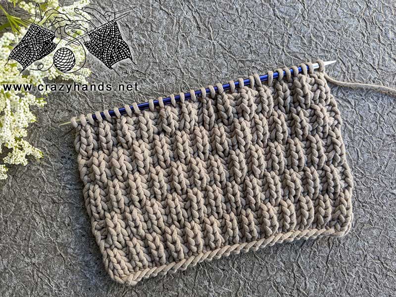 knit fisherman's rib stitch in a checkerboard pattern