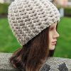 knit flat super bulky hat on a mannequin's head - right side view