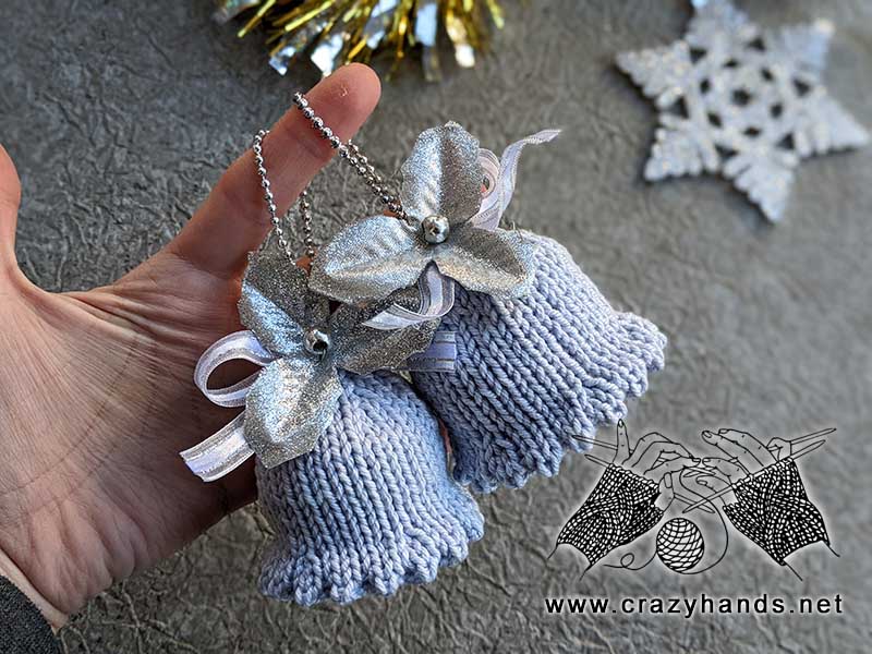knit Christmas bells with a rattle inside and decor elements outside