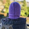 backside view of a knit ribbed hooded cowl on a female model