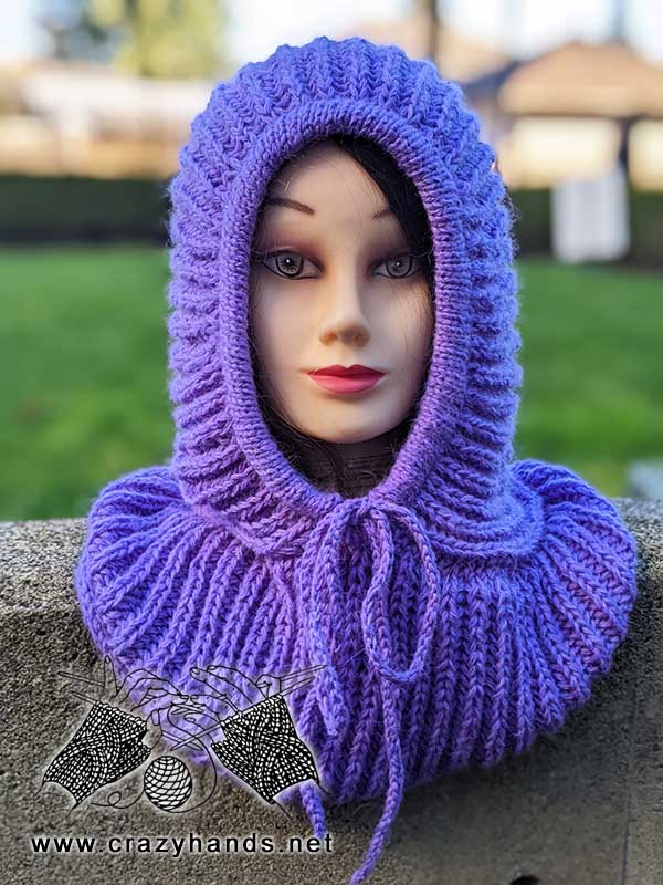 close-up view of a knit ribbed hooded cowl on a mannequin head