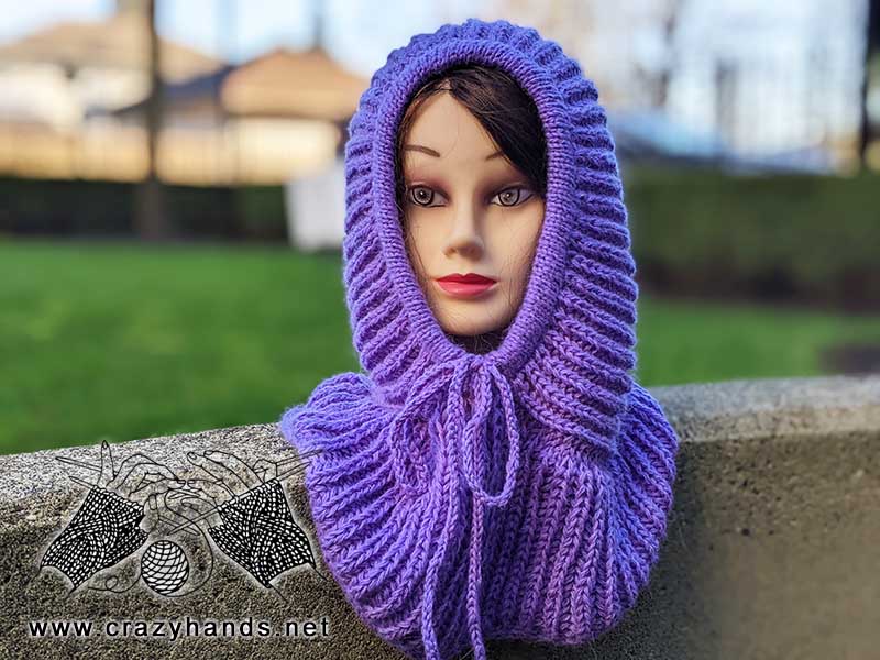 front view of a knit ribbed hooded cowl on a mannequin head