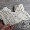 knit newborn baby socks made in round - close-up view