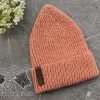 knit ribbed smooth hat made in beige/pastel orange color