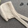 knit super bulky bonnet on a flat surface - right side view