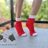 knit no-heel Santa socks on the female model feet