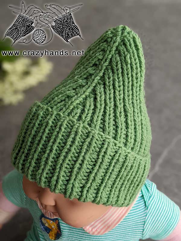 knit mountain infant hat on a baby doll - left side view