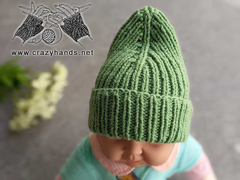 knit mountain infant hat on a baby doll - top side & crown view
