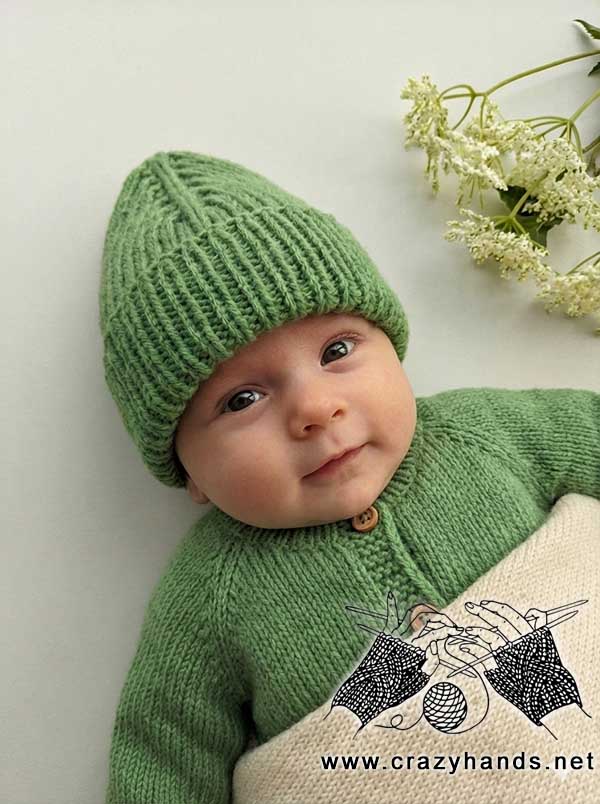 knit mountain hat on a baby model