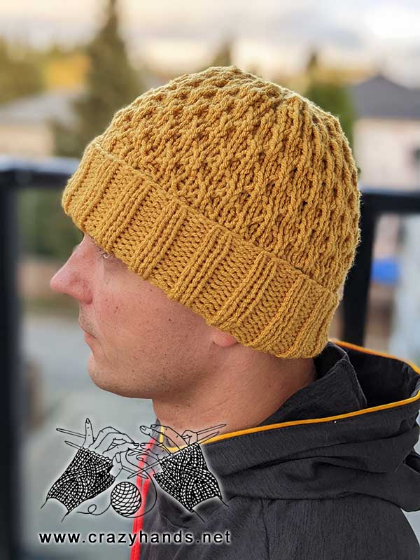 quick and cozy knit hat on a male model - left side view