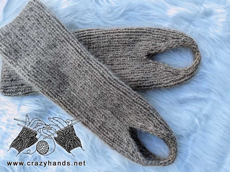 knit stirrup leg warmers laying flat one over another