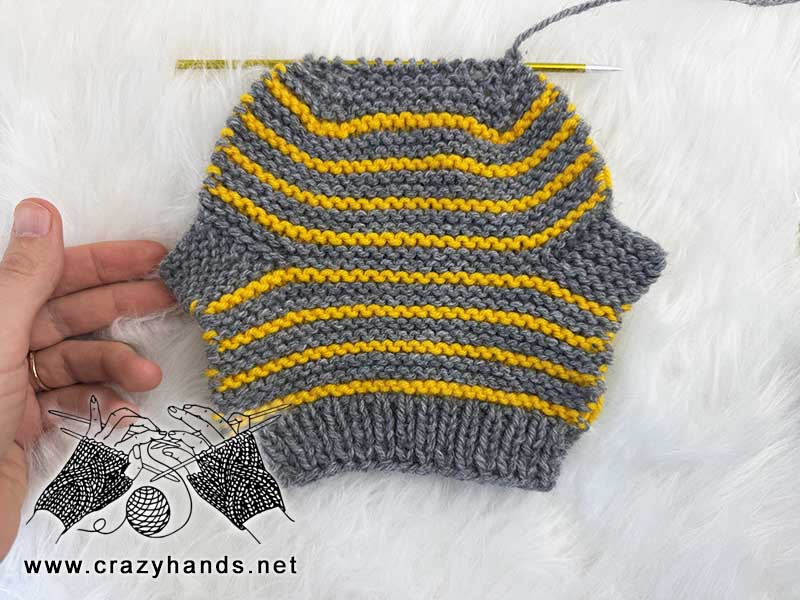 knit flat striped baby sock before sewing it up