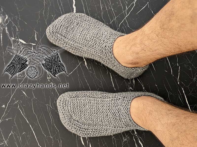 flat knit low-cut men's size slippers on the male's feet - top view