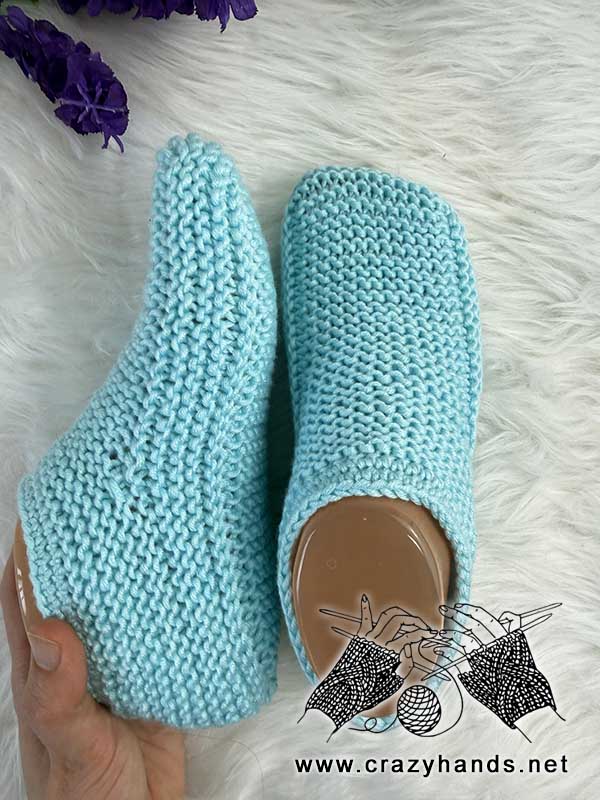 knit cozy house slippers on the mannequin's feet