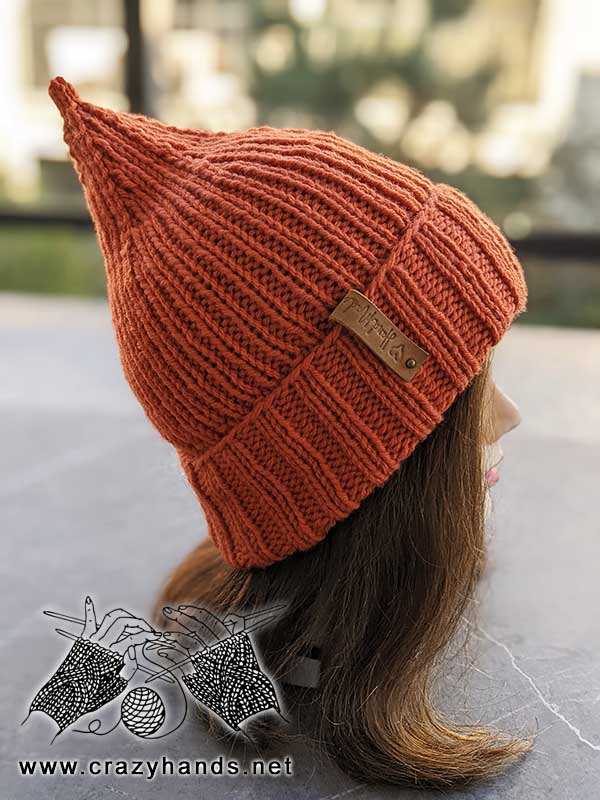 knit pumpkin hat on mannequin's head - right side view
