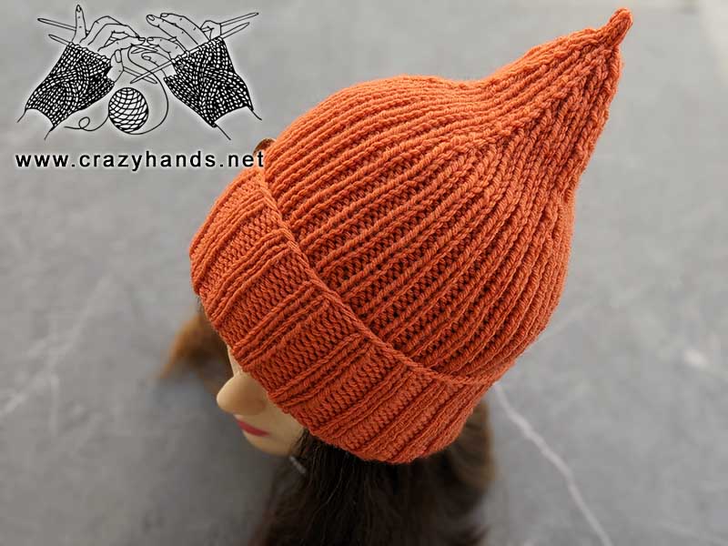knit pumpkin hat on mannequin's head - top front side view